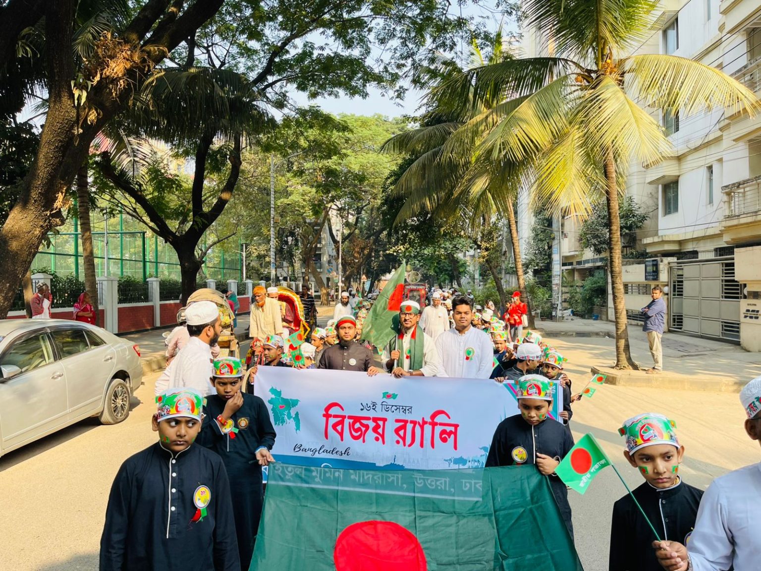 মাদরাসার ছাত্রদের জাতীয় পতাকা বুকে নিয়ে বিজয় র্যালি